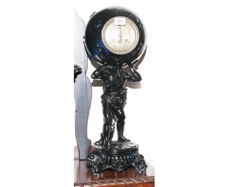 Black painted ball shaped, striking mantel clock on atlas figure base