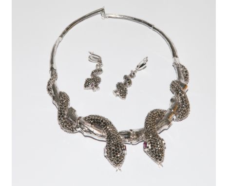 Large silver marcasite snake design choker necklace with ruby set eyes and a pair of matching pierced drop earrings 