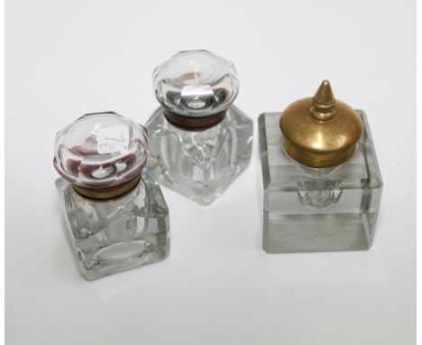 Three heavy glass desk inkwells