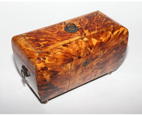 Early Victorian blonde tortoiseshell 3 division tea caddy, of shaped form, with pressed gilt brass handles and ball feet, dar