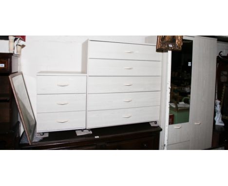Modern light pine effect bedroom suite comprising of 2' 6" combination style wardrobe, chest of 5 drawers and a 3 drawer beds