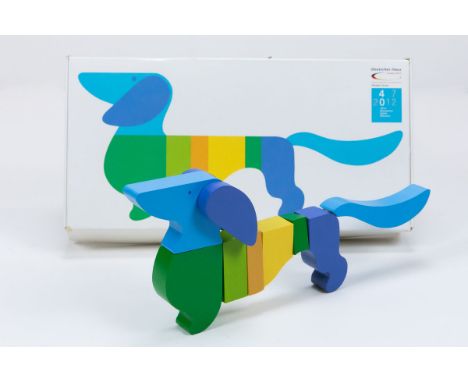 Maskottchen 1972 - Olympische Spiele 1972 Maskottchen „Waldi“ als auseinandernehmbares farbiges 3D-Holzpuzzle von der Firma „