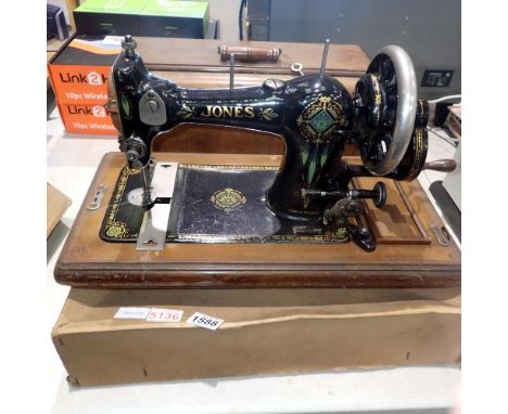 Cased manual Jones sewing machine and a wedding dress. Not available for in-house P&amp;P 