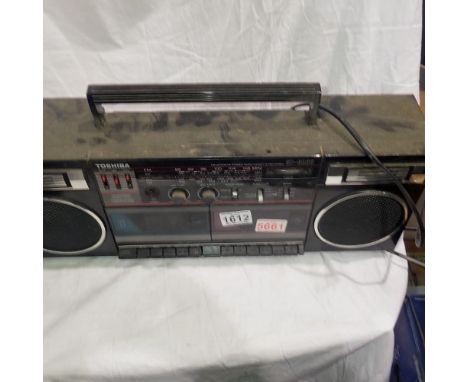 Toshiba twin tape and radio portable stereo system. All electrical items in this lot have been PAT tested for safety and have