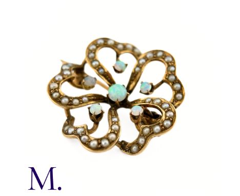 An Opal and Pearl BroochThe floral patterned openwork brooch in 9ct yellow gold is set with good colour opals and pearls.Weig
