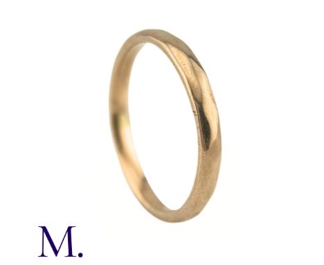 A Faceted 9ct Rose Gold BandThe band is marked for 9ct gold and dates to 1939.Weight: 1.8gSize: M 