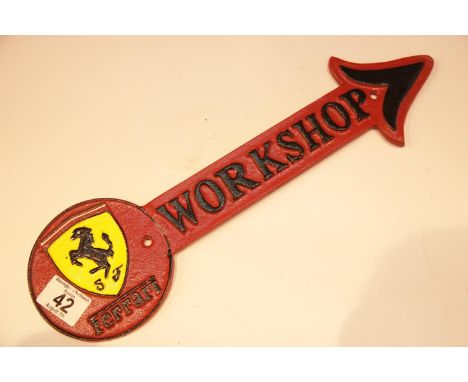 Cast iron Ferrari Workshop arrow sign, 41 x 12 cm. P&amp;P Group 2 (£18+VAT for the first lot and £2+VAT for subsequent lots)