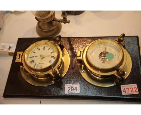 Vintage type brass bulkhead clock and barometer by Nauticlia and a brass candle wall light. This lot is not available for in-