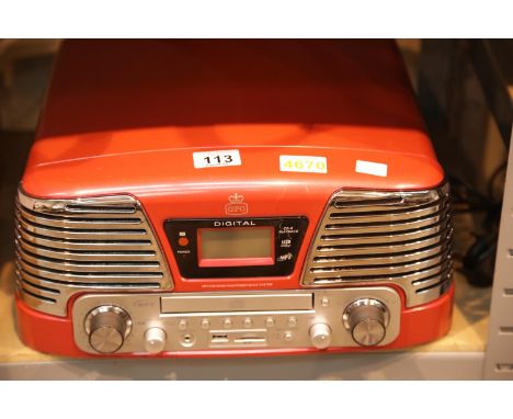 Red GPO Memphis retro music centre - 3 speed turntable: 33/45/78; MP£/USB player; FM radio. P&amp;P Group 3 (£25+VAT for the 