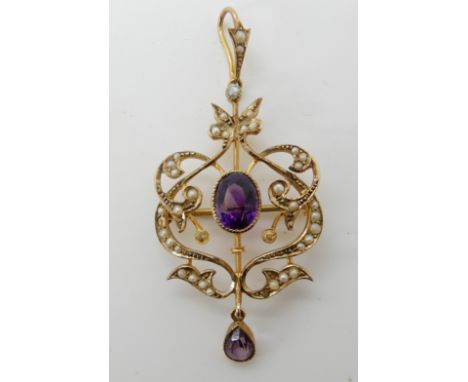 A 9ct gold amethyst and pearl Edwardian pendant brooch, length 5.8cm, weight 4.9gms Condition Report: Three small pearls miss