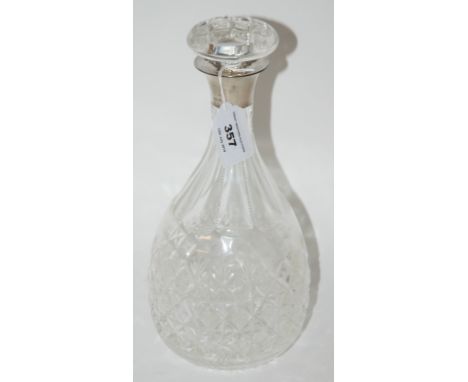 A cut glass decanter with silver collar, Birmingham 1938, 29.5cm high Condition Report: Available upon request