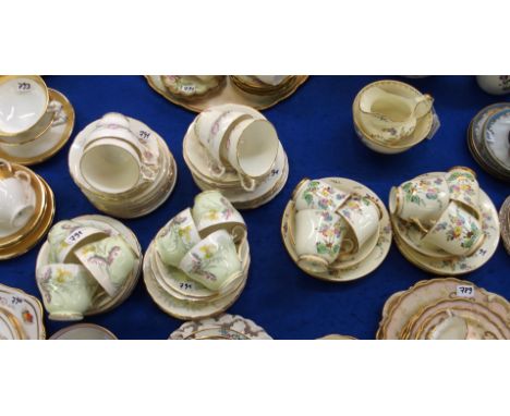 A Plant Tuscan teaset decorated with flowers on a yellow ground comprising; six cups, saucers and plates, milk jug and sugar 