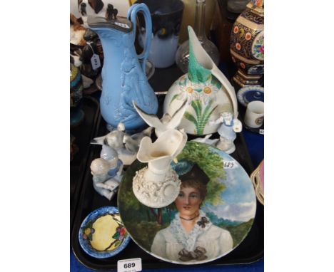 A Belleek First Period (Second Mark) jug with relief floral decoration, a French porcelain plate handpainted with a portrait 