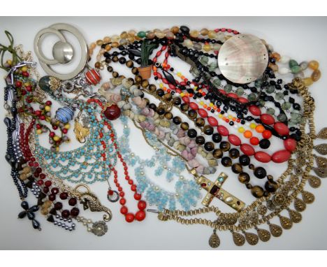 A collection of vintage costume jewellery to include, German blue glass bead necklace, tigers eye beads etc Condition Report: