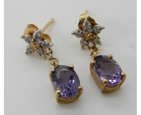 A pair of 9ct gold amethyst and diamond flower drop earrings, length 2cm, weight 1.5gms Condition Report: Light general wear.