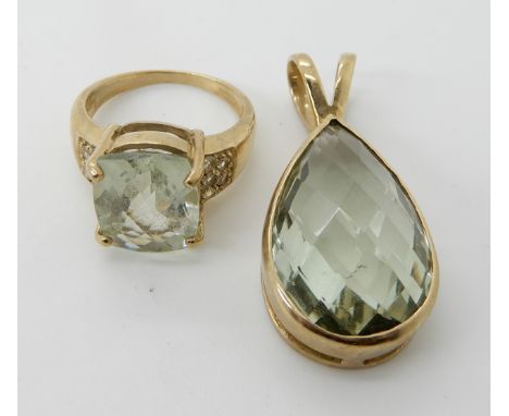 A 9ct gold green amethyst pendant with matching ring size O Condition Report: light general wear. 