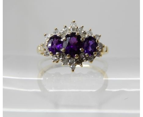 A 9ct gold amethyst and diamond cluster ring, size N1/2, weight 2.1gms Condition Report: Available upon request