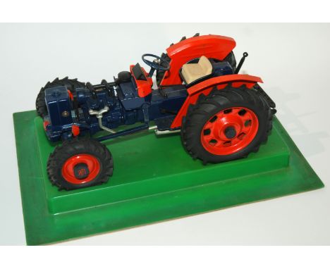 A Dugu model tractor with original box cover, tri-ang Mimic boat, Jack in the boat (def) etc Condition Report: Available upon