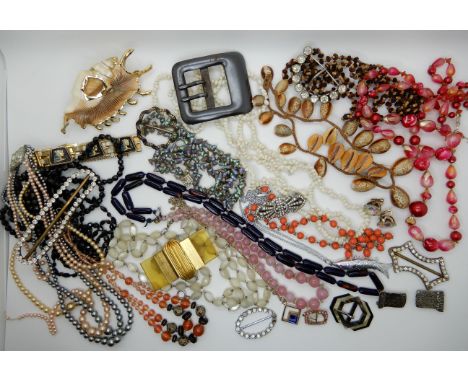 A collection of vintage costume jewellery to include, shell beads, Deco buckles, Deco clip etc Condition Report: Not availabl