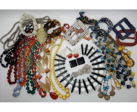 A collection of vintage costume jewellery to include, a 60's statement necklace, good beads, necklaces etc Condition Report: 