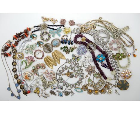 A collection of vintage costume jewellery to include a silver bird pendant, clips etc Condition Report: Not available for thi