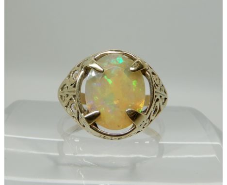 A 9ct gold gents ring set with a jelly opal, size V, weight 3.6gms Condition Report: Available upon request