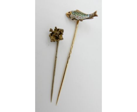 A yellow metal and enamel trout pin with ruby eye, together with a yellow metal nugget pin weight 4.1gms Condition Report: Av