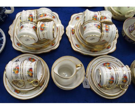 A Royal Albert Crown China 'Fruit' pattern teaset comprising; twelve cups, saucers and plates, milk jug, sugar bowl and two c