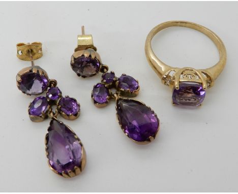 A 9ct gold amethyst ring, size N1/2 and a pair of yellow metal drop earrings length 3.1cm, combined weight 6.5gms Condition R