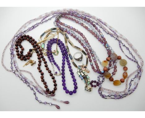 A mother of pearl seahorse pendant necklace, amethyst beads red tigers eye beads Condition Report: Not available for this lot