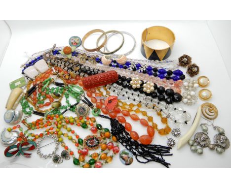 A collection of vintage costume jewellery to include, a green and black glass flapper necklace, other deco beads a Bakelite b