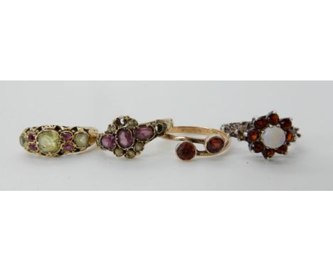 A 9ct gold garnet and pearl ring, size O1/2, a further similar yellow metal gem set ring size J, a 9ct twin garnet ring size 