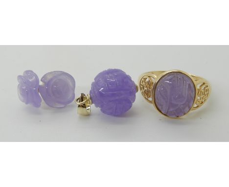 A 14ct gold ring set with a carved lilac jade size O1/2, a 14k mounted lilac jade Chinese symbol ball pendant and a pair of l