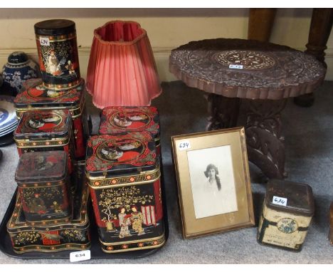 Various vintage tins and canisters with chinoiserie scenes, a framed photograph and carved wooden small folding table Conditi