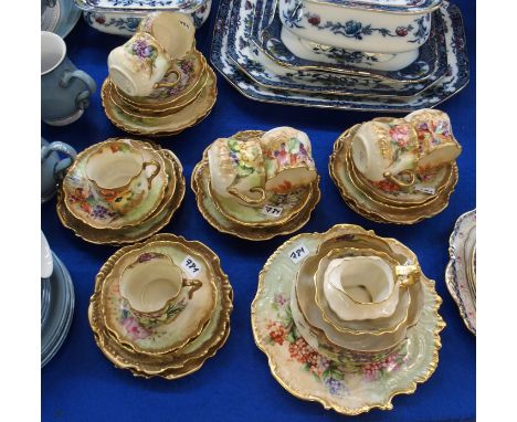 A Nautilus porcelain handpainted teaset decorated with different flowers comprising; eight cups, eleven saucers, twelve plate