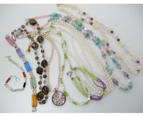 A silver mounted hardstone and mixed gem set bracelet, a silver, peridot and amethyst bead bracelet, pearls smoky quartz bead