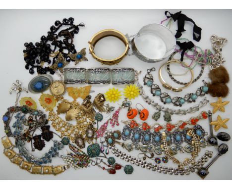 A collection of vintage costume jewellery to include, a Masonic eastern star bangle, a gold plated flower bangle etc Conditio