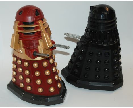 Two novelty money banks, one in Newcastle United team colours the other Nottingham Forest, two Daleks (def) and toy drum Cond