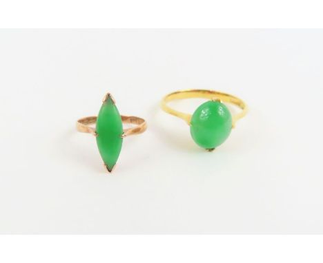 A jade single stone ring, the shank marked '18k' and with Chinese control marks, finger size N; together with a child's jade 