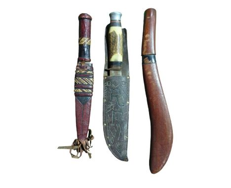 A hunting knife with broad blade marked "William Rogers" having antler grip and in leather sheath, blade 20cms together with 