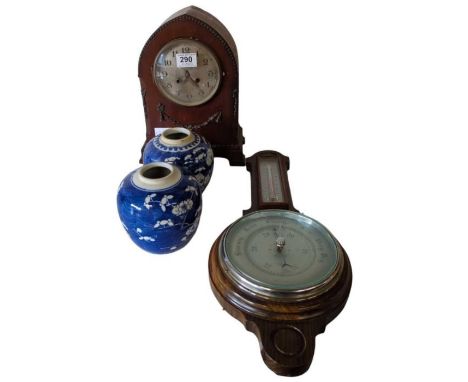 An Edwardian mantel clock, two blue and white ginger jars and an aneroid barometer