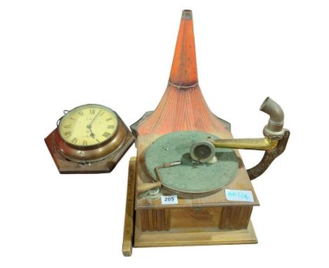 A table top gramophone with decorative cast metal arm support and original painted metal horn; an early 20th Century electric