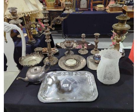 A Victorian brass oil lamp with decorative etched glass shade; a large silver plated two branch candelabra; other silver plat