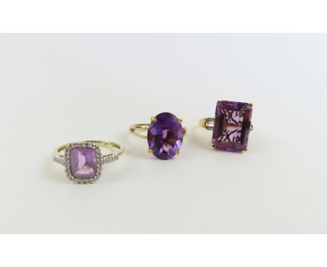 A 9ct gold oval amethyst cocktail ring, finger size R 1/2; a 9ct gold amethyst and white stone cocktail ring, finger size R a