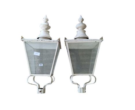 A pair of 19th century white painted metal lamp shades, 97cm high