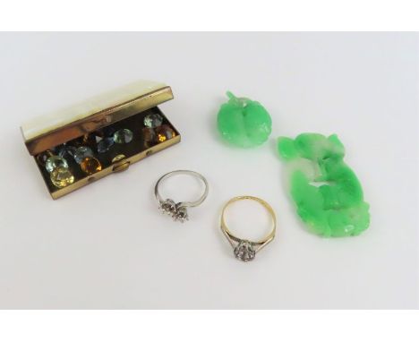 A ring mount, marked '18ct', 2.4g gross; an unmarked ring mount, tests as platinum, 3g gross; two carved pieces of jade and a