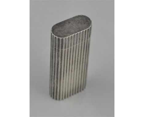 A Cartier silver petrol cigarette lighter, with fluted casing, Swiss made, stamped 74232V, dated 1989, (white metal assessed 