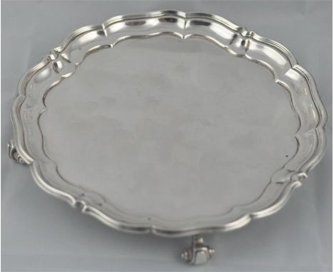 A silver salver,&nbsp;by&nbsp;Harrison Brothers &amp; George Howson, London 1918, having stepped&nbsp;scalloped&nbsp;rim, rai