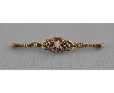 A 9ct gold bar brooch, the open work bar mount&nbsp;set&nbsp;central opal surrounded amethysts, hallmarked 9 carat gold, leng