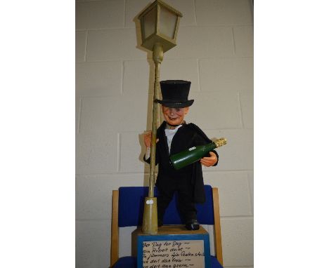 A DRUNKEN FIGURE AUTOMATON AND TABLE LAMP, not tested, by Christian Hofmann, drunk figure sways while holding lamp standard, 